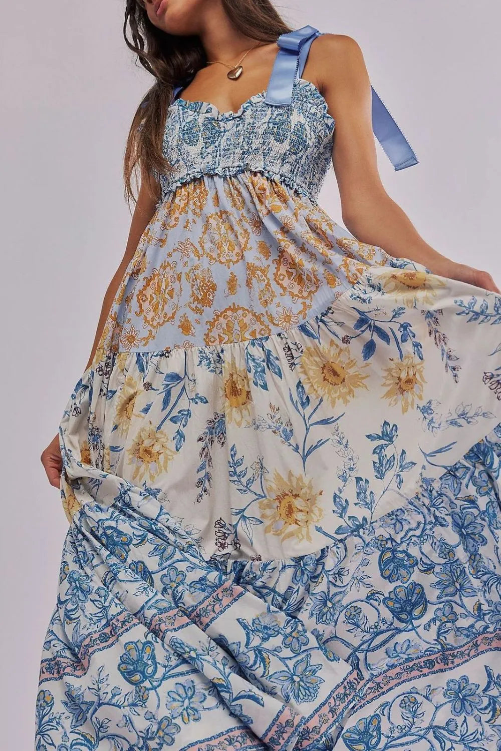 Floral tiered maxi dress in soft blue cream print with gold accents