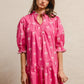 Vibrant pink BiBi ribbon pattern scallop edge short sleeve dress with white bows and puffed sleeves