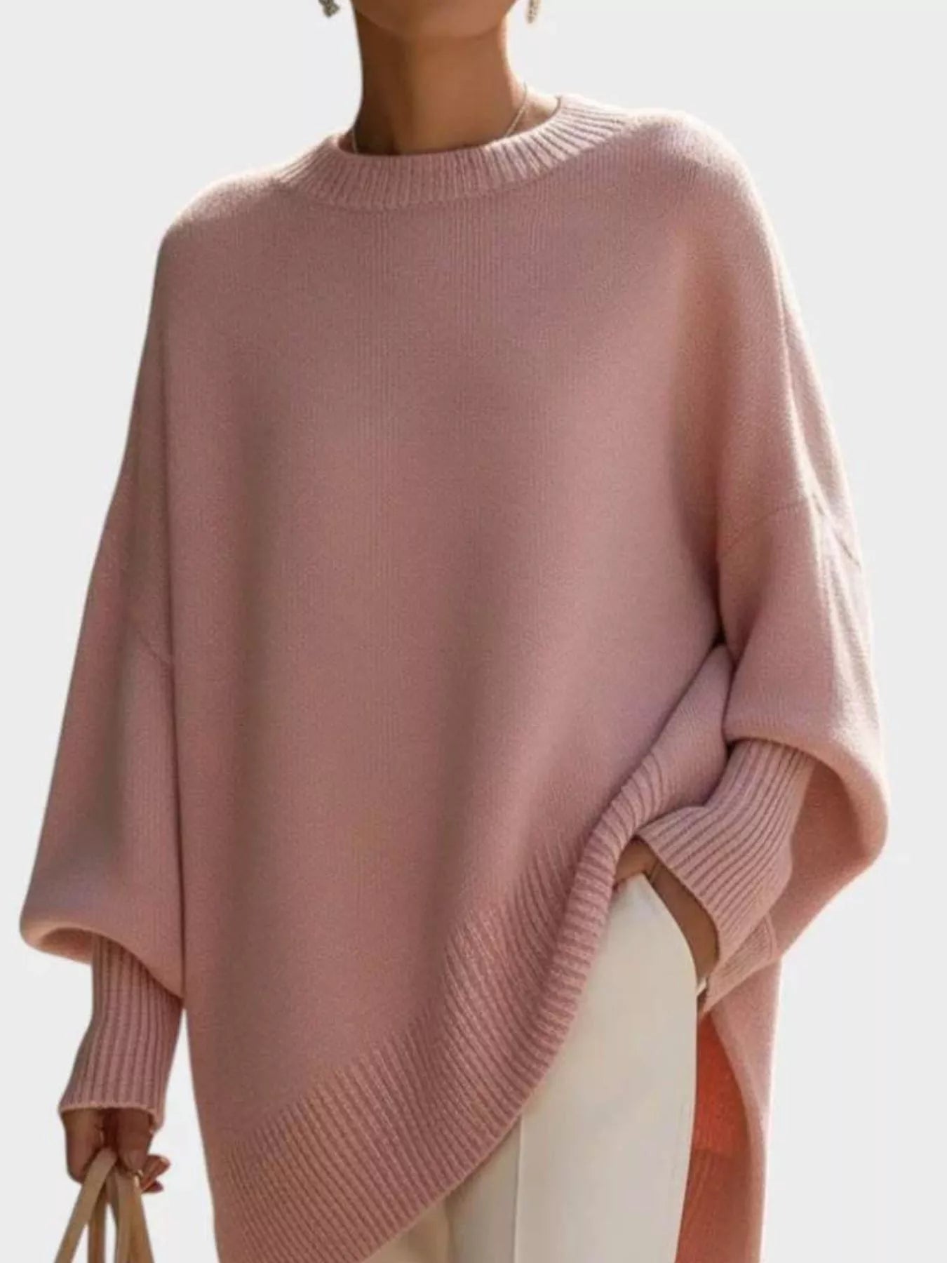 Women’s soft pink oversized batwing sleeve knit sweater with ribbed cuffs