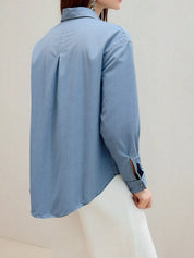 Daverri Fashions light blue plus size denim shirt with rolled sleeves and distressed details