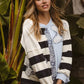 Woman in BiBi Patchwork Striped Round Neck Sweatshirt with lace and paisley patches