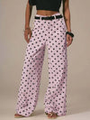 Daverri Polka Dot Wide Leg Jeans in light pink with black polka dots and belt