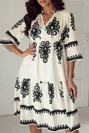 White and black embroidered bell sleeve knee length dress