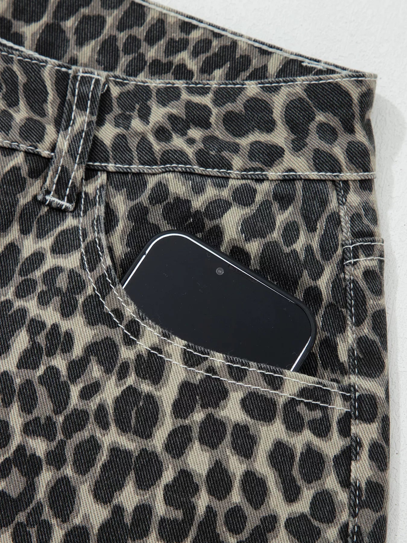 Daverri Leopard Print High Waist Barrel Jeans in black and beige denim with white stitching
