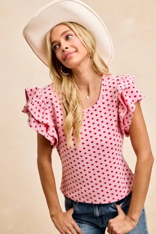 BiBi pink heart-patterned knit top with ruffled short sleeves