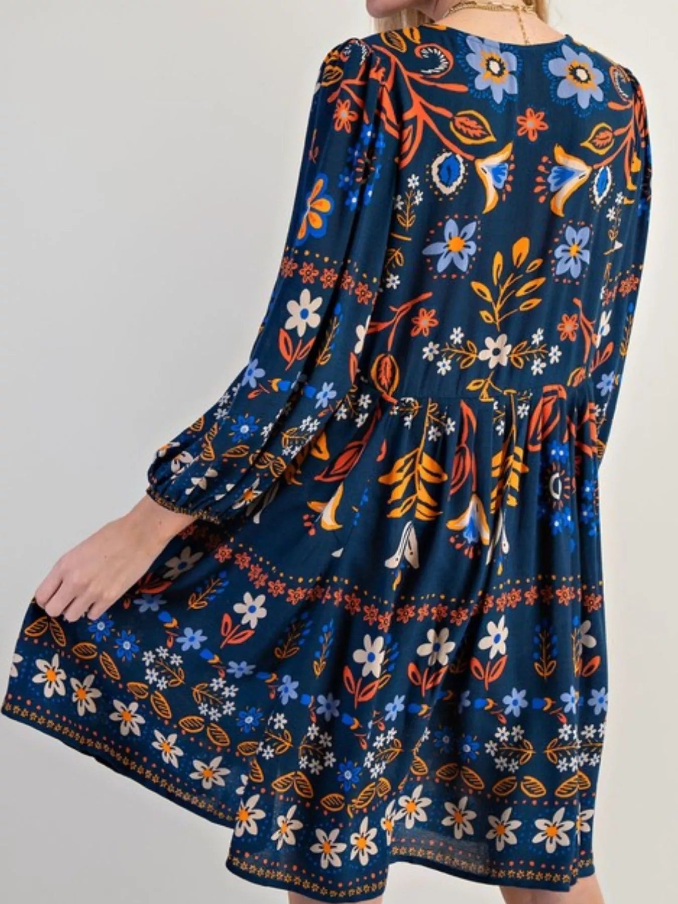 Bohemian floral print long sleeve mini dress in navy blue with puffy sleeves and fitted waist