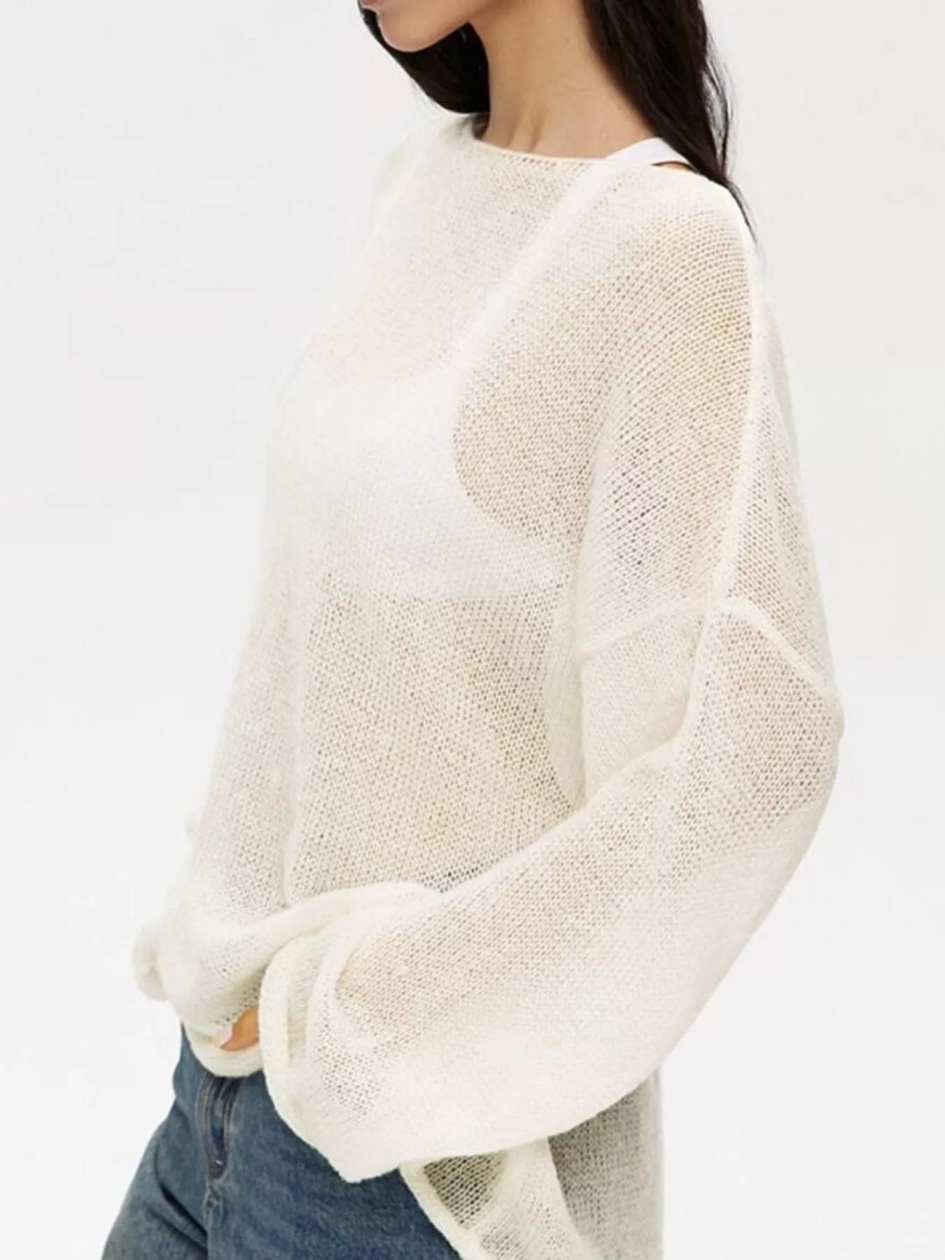 Boat neck dropped shoulder sweater in loose off-white knit with sheer texture and wide sleeves