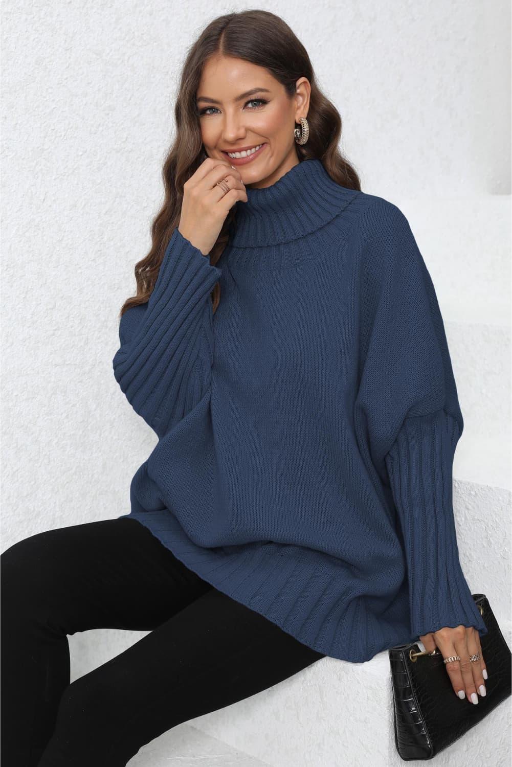 Navy blue turtleneck sweater with ribbed detailing and balloon sleeves