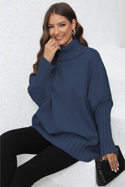 Navy blue turtleneck sweater with ribbed detailing and balloon sleeves