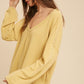 Casey Top: mustard-yellow ribbed knit sweater, long sleeves, relaxed fit