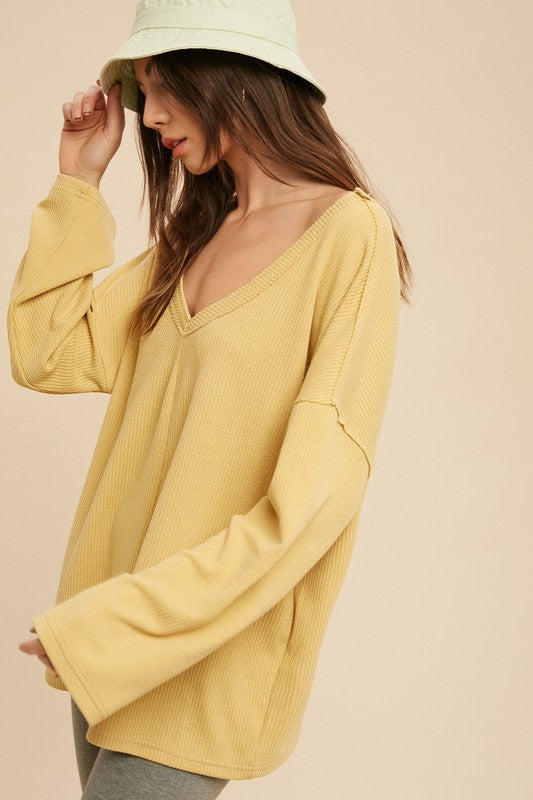 Casey Top: mustard-yellow ribbed knit sweater, long sleeves, relaxed fit