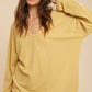 Casey Top: yellow ribbed long-sleeve v-neck blouse