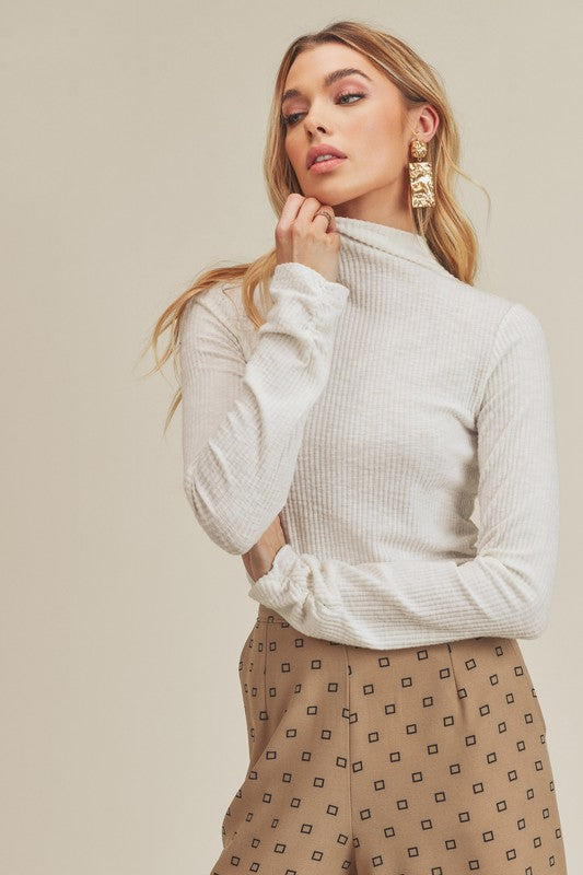 Aemi + Co soft ribbed white mock neck top with ruched sleeves