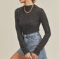 Black ribbed Aemi + Co mock neck ruched sleeve turtleneck top