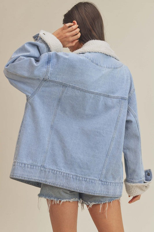 Light blue Aemi + Co denim jacket with white shearling collar and cuffs, large