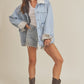 Light blue Aemi + Co denim jacket with shearling lining and frayed cuffs