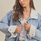 Light blue Aemi + Co denim jacket with white shearling collar and cuffs