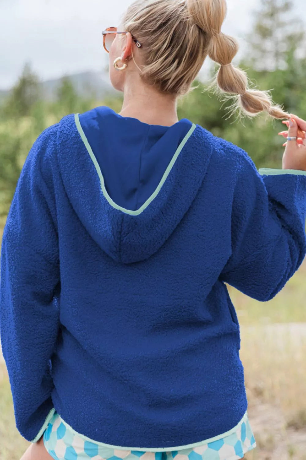 Royal blue Sherpa quarter-zip hoodie with teal trim