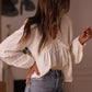 Lace Trim V-Neck Blouse with intricate ivory lace sleeves and ruffled hem