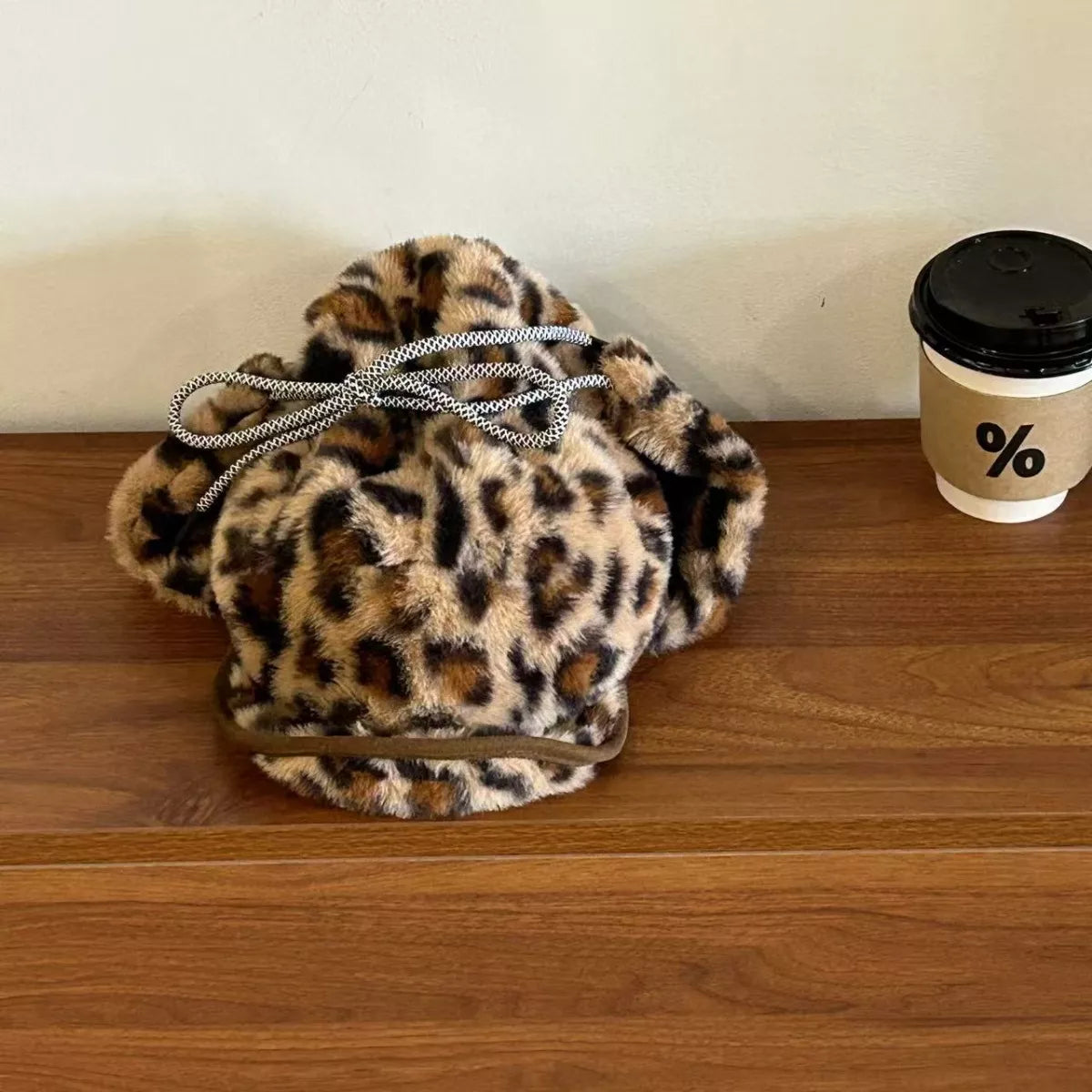 Leopard print faux fur trapper hat with silver chain drawstring