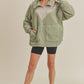 Moss green Aemi + Co. Aspen oversized half-zip fleece pullover with beige chest panel