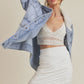 White ruched mini skirt with Aemi + Co denim jacket