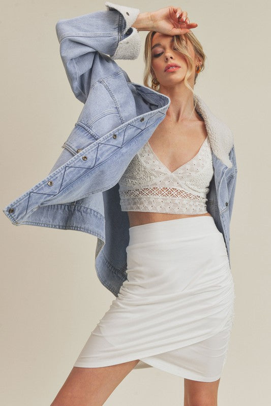 White ruched mini skirt with Aemi + Co denim jacket