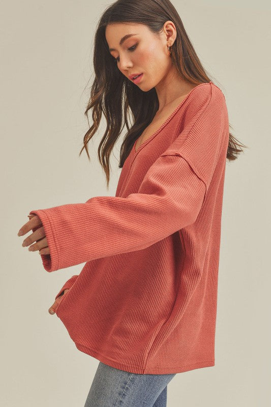 Casey Top: soft coral ribbed knit sweater, relaxed fit, long sleeves