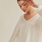 Casey Top: soft off-white ribbed knit v-neck sweater