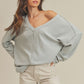 Light gray ribbed knit off-shoulder Casey Top with v-neckline