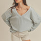 Light blue ribbed knit Casey Top with loose oversized fit and v-neckline