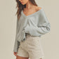 Light blue ribbed knit off-the-shoulder Casey Top sweater