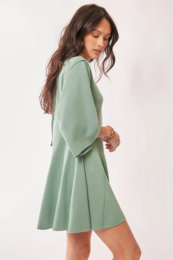 Davi & Dani Solid Draped Sleeve Ties Back Skort Romper Rompers