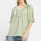 Sage green and white striped Umgee V-neck blouse with puff sleeves