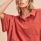 Rust-colored Aemi + Co relaxed fit half sleeve striped cotton top small