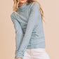Light blue ribbed knit Aemi + Co mock neck ruched sleeve top