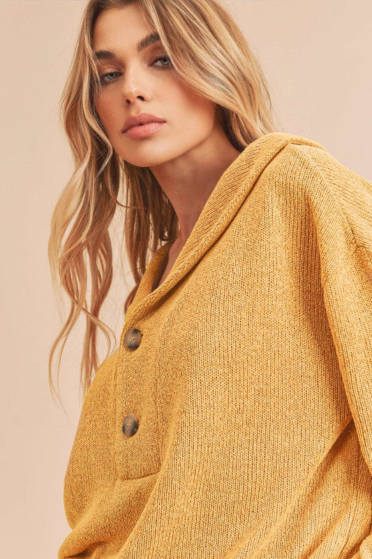 Cozy mustard-yellow Aemi + Co knitted cardigan with brown buttons