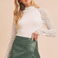 Green faux leather wrap skirt with Aemi + Co mock neck lace top