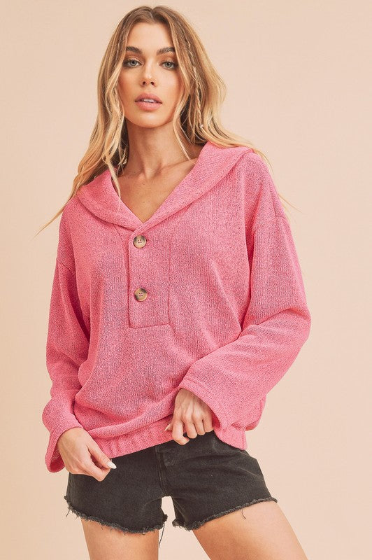 Pink textured Aemi + Co hooded pullover with buttons and pocket