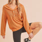Orange textured knit Aemi + Co button front relaxed fit pullover with ribbed cuffs
