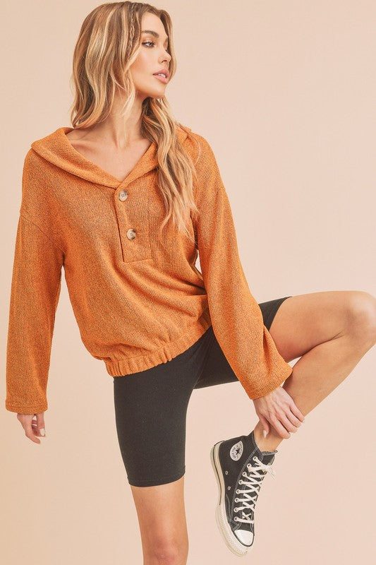 Orange textured knit Aemi + Co button front relaxed fit pullover with ribbed cuffs