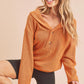Cozy rust-orange Aemi + Co button-front knit hoodie with soft hood