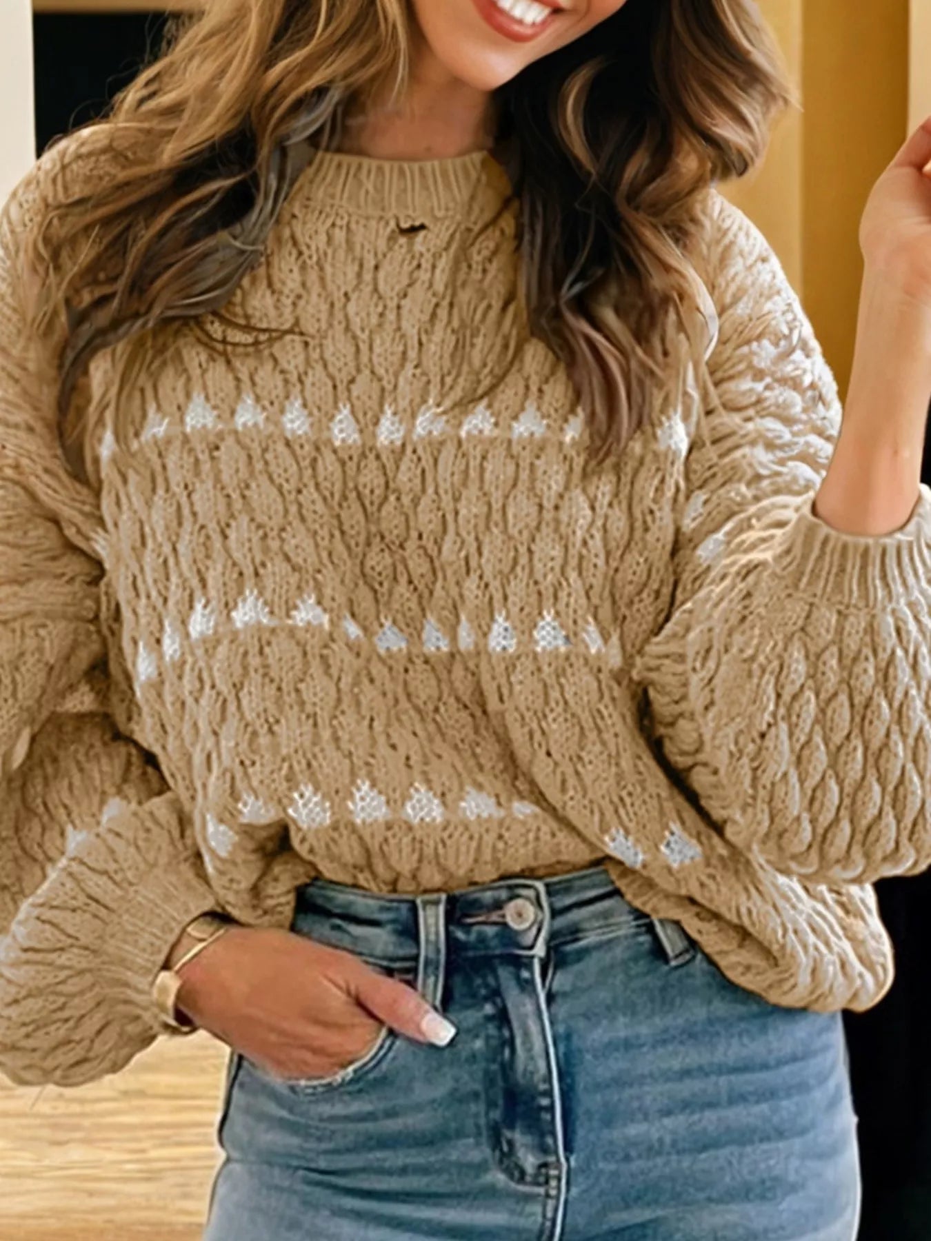 Beige women’s baggy sweater with white geometric patterns and chunky knit texture