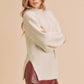 Cream-colored fluffy Aemi + Co side slit mock neck knit sweater small