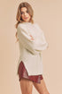 Cream-colored fluffy Aemi + Co side slit mock neck knit sweater small