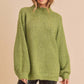 Cozy olive-green fuzzy knit sweater with turtleneck and side slit hem by Aemi + Co