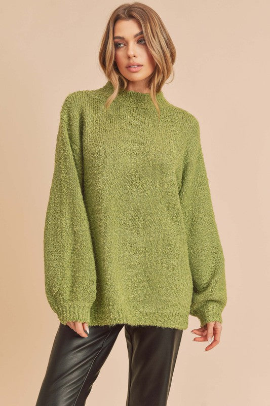 Cozy olive-green fuzzy knit sweater with turtleneck and side slit hem by Aemi + Co