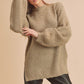 Cozy oversized beige fuzzy knit sweater with mock neck and side slit hem