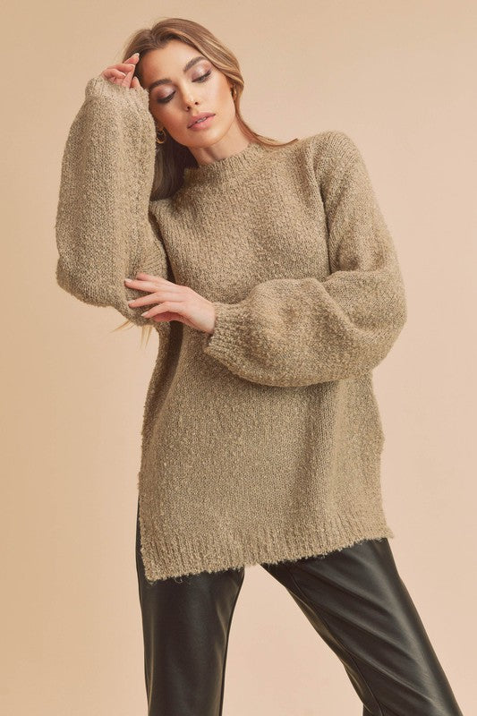 Cozy oversized beige fuzzy knit sweater with mock neck and side slit hem