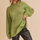 Cozy olive-green Aemi + Co loose fit mock neck knit sweater with side slits